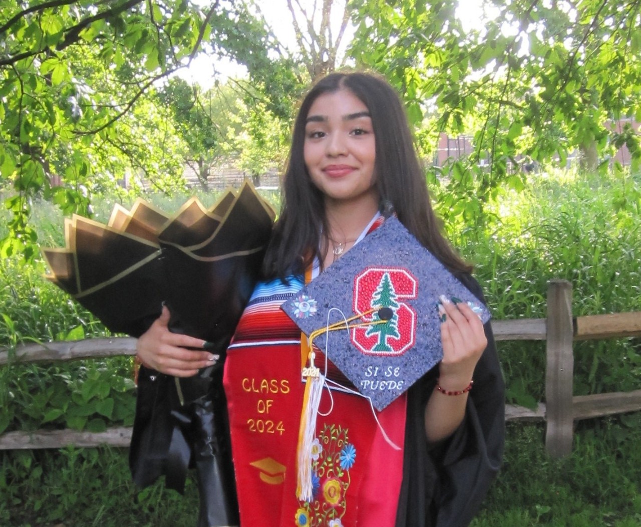 Picture of Guadalupe M. an AA graduate and link to her story.