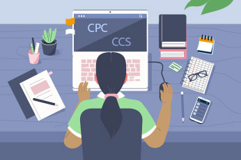 Person typing on laptop displaying "CPC CCS" at cluttered desk with office supplies