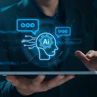 A person holds a digital tablet displaying a glowing holographic interface with an AI (artificial intelligence) icon, speech bubbles, and gear symbols, representing the relevance of technology in higher education.